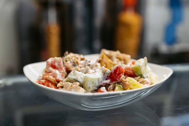 Wait staff serving caesar salad