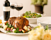 Leg of Lamb with potatoes, greens, and red wine.