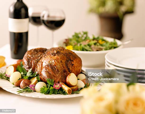 Leg Of Lamb With Potatoes Greens And Red Wine Stock Photo - Download Image Now - Easter, Leg Of Lamb, Wine