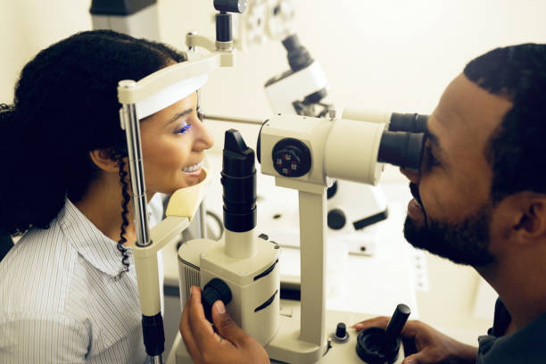 istock Eye test, machine and a woman with a doctor for optometry, vision problem and surgery on lens. Happy, clinic and a patient with a man or optometrist for a medical exam, retina health and check 1768648818