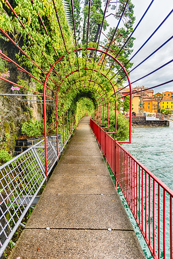 Scenic walkaway in the picturesque village of Varenna on the eastern shore of Lake Como, Italy
