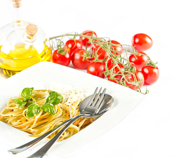spaghetti with tomato sauce, fresh basil and grated parmesan