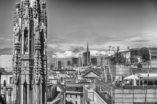 Scenic aerial view over the city centre, as seen from the roof of the gothic Cathedral, Milan, Italy