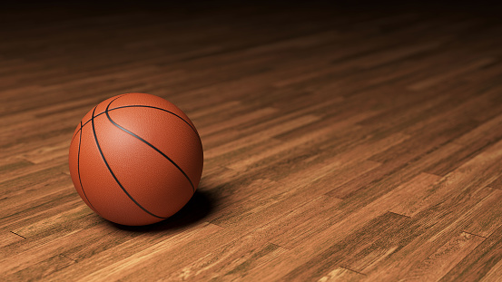 Basketball Ball on the Wood Floor Court