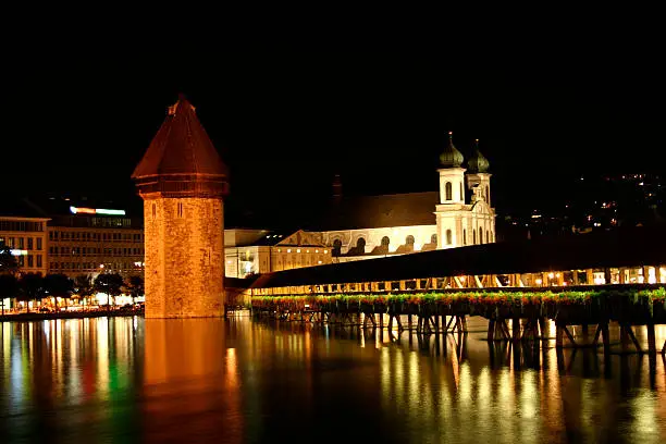 "Digital photo of the famous chapel-bridge in Lucerne in switzerland by night. The bridge was build in the year 1365, it is the oldest and longest (204 m) bridge with a roof in europe."
