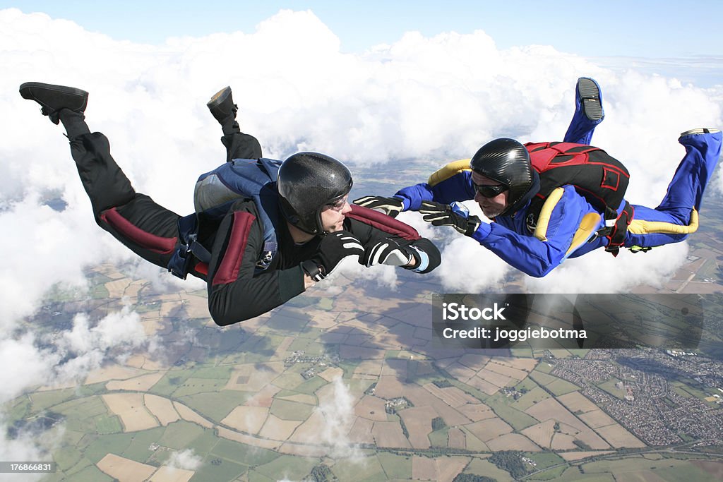 Two skydivers in freefall Two skydivers in freefall on a sunny day Parachuting Stock Photo