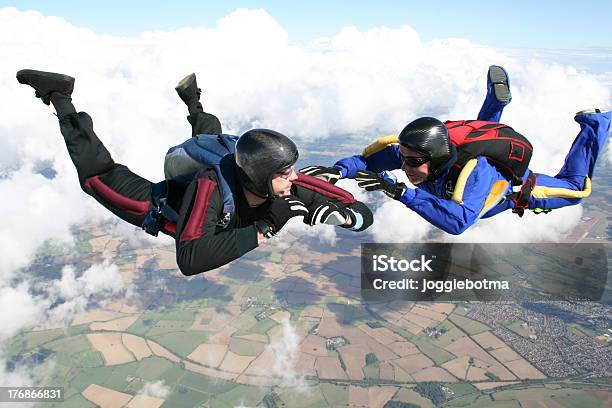 Two Skydivers In Freefall Stock Photo - Download Image Now - Parachuting, Holding Hands, Order