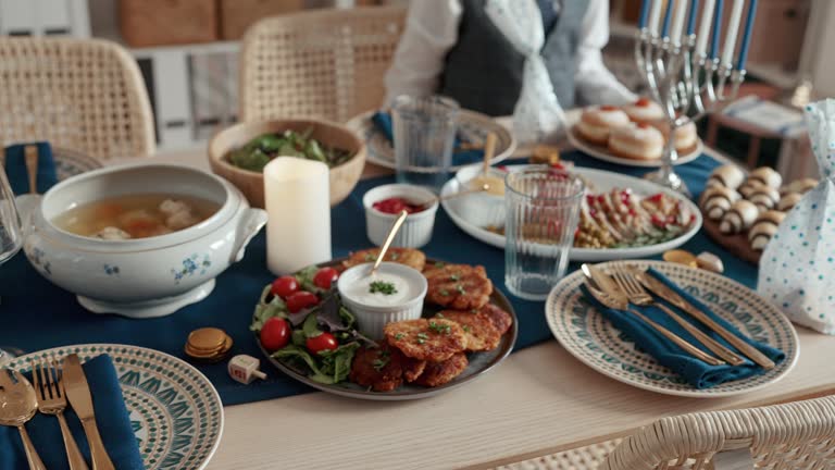 Close-up video of a table with traditional Jewish food prepared for Hanukkah