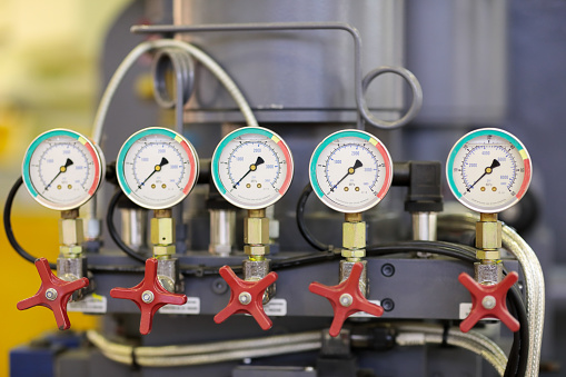 Closeup of industrial machine with pressure gauges. Pneumatic control system. Selective focus.