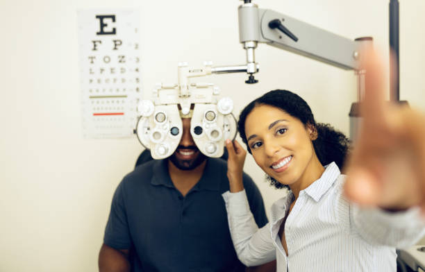 istock Woman, optometrist or optical equipment for eye testing, optometry or doctor for exam, assessment or vision. Healthcare, man or eyesight in consult, glasses and clinic for checkup, diagnosis or job 1768692514
