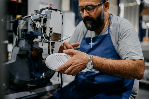 Cobbler making a shoe in his workshop