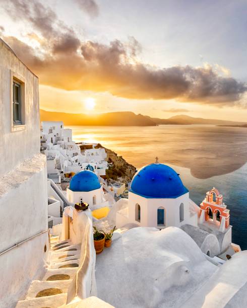 Sunset in Oia Blue domed churches at sunset. 4810 stock pictures, royalty-free photos & images