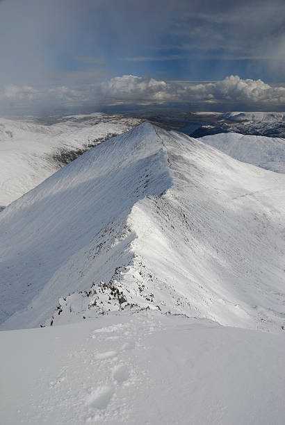 istock Footprints above Swirral Edge and Catstye Cam in winter 176869778