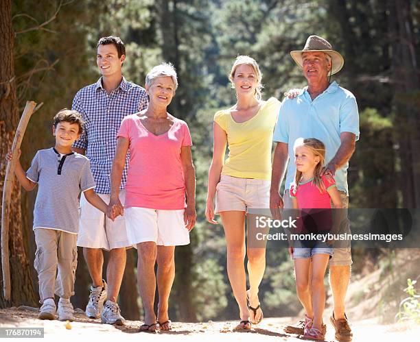 3 Generation Family On Country Walk Stock Photo - Download Image Now - 30-39 Years, 6-7 Years, 60-69 Years