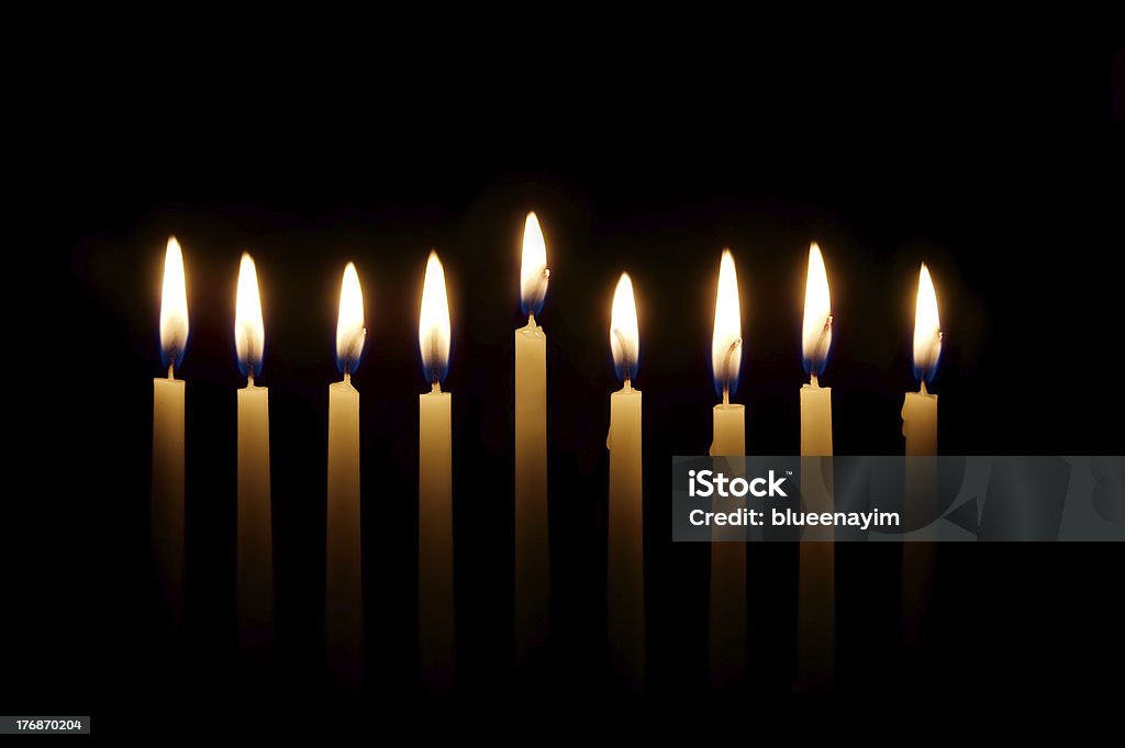 Hanukkah Candles Glowing candles lit for the eighth night of Hanukkah Hanukkah Stock Photo