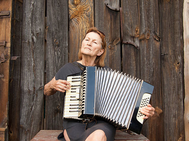 istock senior with a accordion 176870588