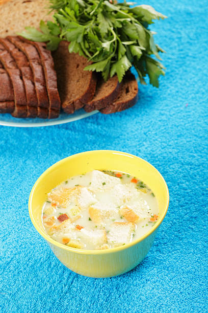 istock Cheese soup and bread with greens 176871239