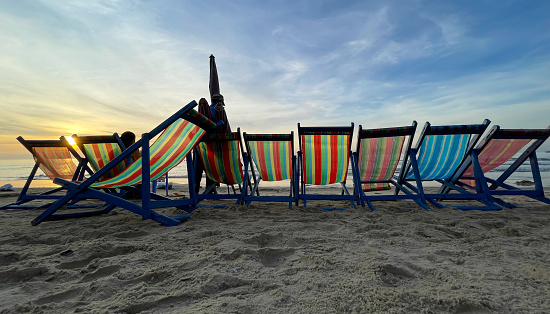 Chairs leaning on Vung Tau beach, sunrise on the sea, Ba Ria Vung Tau province