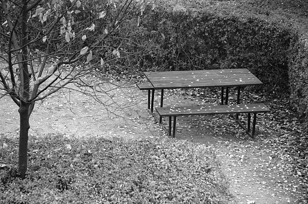 Lonely picnic table Table and benches on a playground alintal stock pictures, royalty-free photos & images