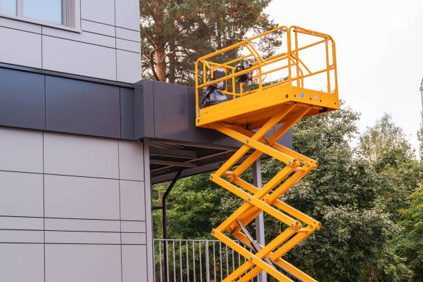 mobile lifting cradle. Construction scissor lift. mobile lifting cradle. Construction scissor lift. electric mobile lifting cradle on wheels for work at height. Scissor lift platform with hydraulic system painted in orange colors. close-up yellow scissors stock pictures, royalty-free photos & images