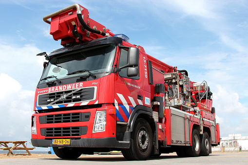 Scheveningen, Netherlands - August 6, 2012: Dutch Volvo FM fire engine beside the beach