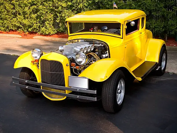 A classic restored 1931 yellow Ford hot rod.