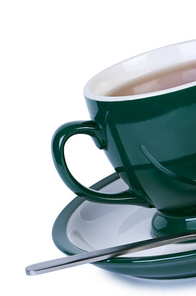 istock Cup tea on saucer with spoon isolated. 176874615