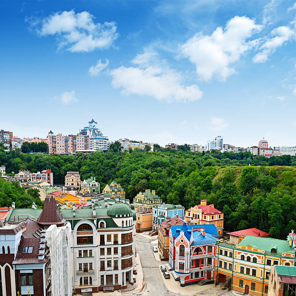 Multicolored houses among the green trees