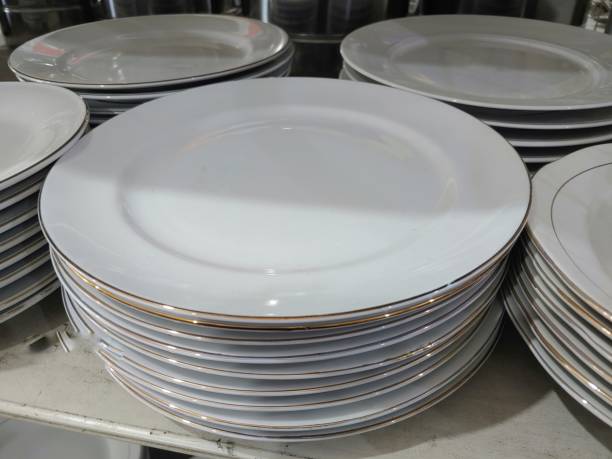 Stack of white plates in dishes shop
