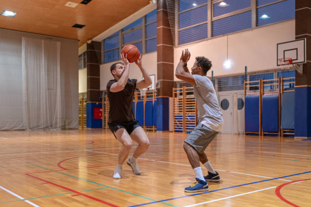 istock Two friends play basketball 1768757079