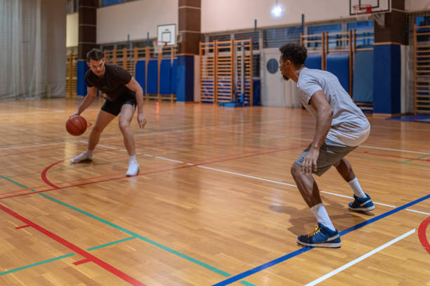 istock Two friends play basketball 1768757087