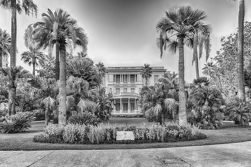 NICE, FRANCE - AUGUST 11: Facade of Musee Massena inside a beautiful garden with palms located on the Promenade des Anglais in Nice, Cote d'Azur, France, as seen on August 11, 2019