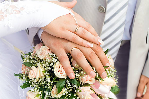 istock The hands of just married couple 176876190