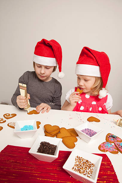 istock Girls decorating gingerbread cookies 176876778
