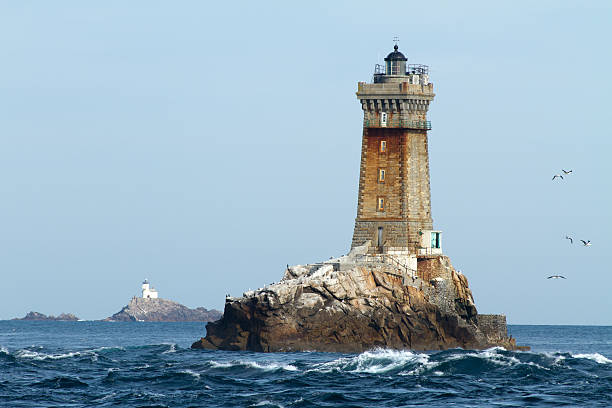 lighthouses in ocean stock photo
