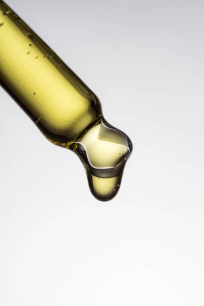 istock closeup of a serum pipette with a falling drop on a white background 1768768595