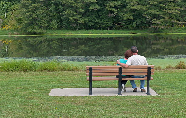 istock Couple Sitting On a Bench In Spring 176876915