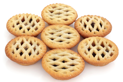Latticed mince pie group over white background. Selective focus.