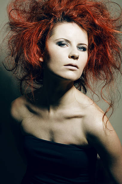 istock Young fashion model with curly red hair. 176877453