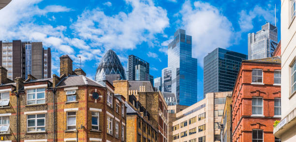 London modern skyscrapers financial district overlooking homes rooftops panorama stock photo