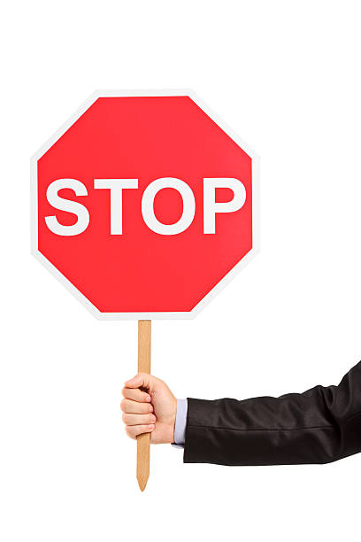 istock Hand holding a traffic sign stop 176877719