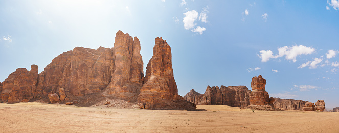 Rocky desert formations with sand in foreground, typical landscape of Al Ula, Saudi Arabia. High resolution panorama.