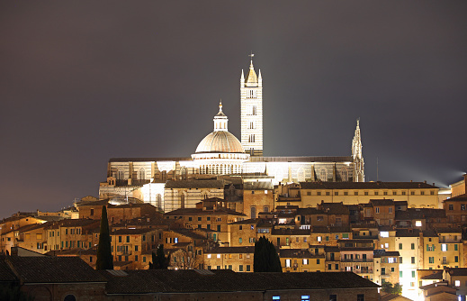 Night view of illuminated Siena Cathedral in Central Italy