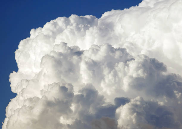 Serene Skyscape: Fluffy Cumulus Clouds Adorning Madrid's Blue Sky (Spain)