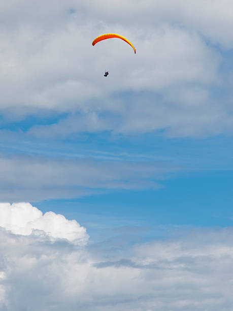 istock Paraglider in front of clouds 176879737