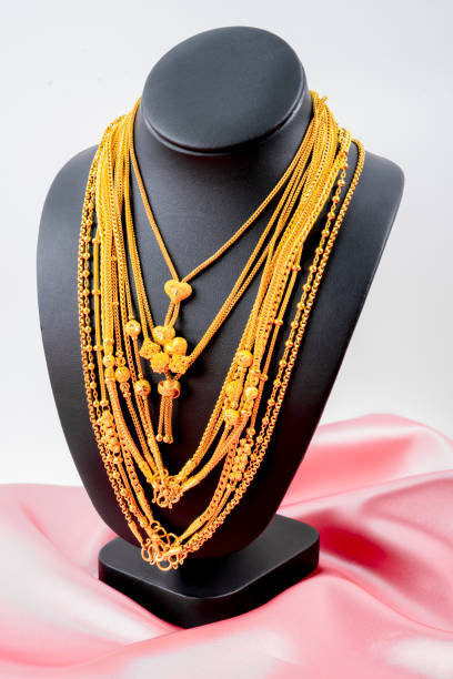 istock Gold necklaces on necklace display stand. 1768797731