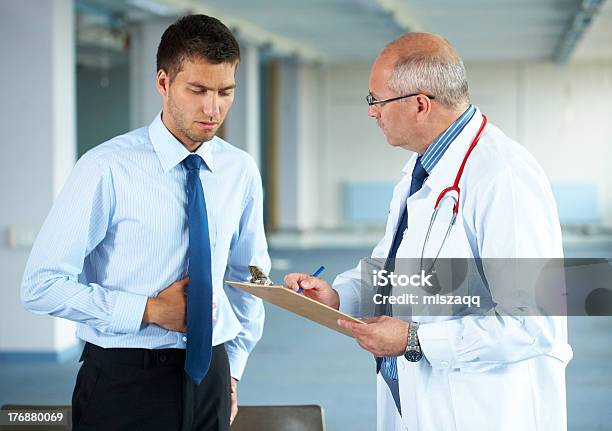 Doctor And His Patient Indoor Shoot Stock Photo - Download Image Now - Doctor, Patient, Men