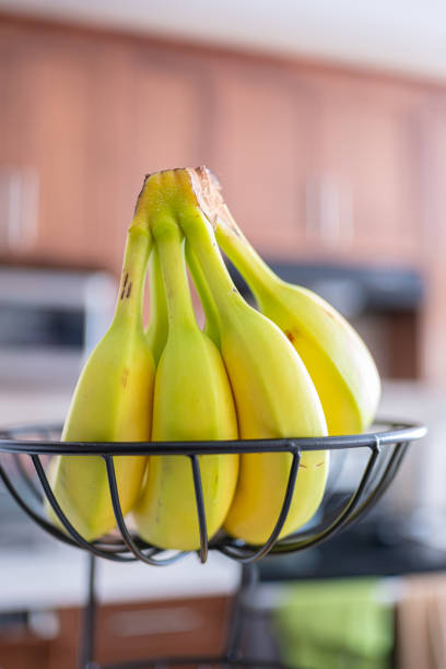 A bunch of Bananas on a kitchen counter