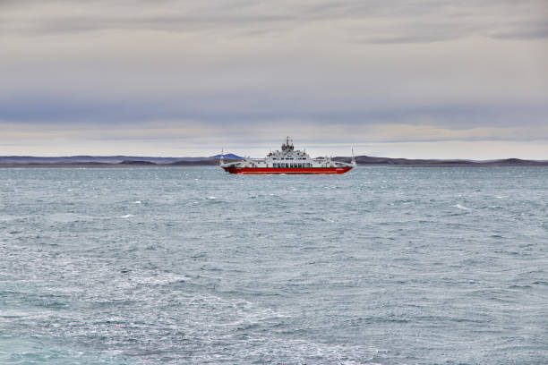 The ferry on Magellanic Strait, Tierra del Fuego, Chile Magellanic Strait, Chile - 21 Dec 2019: The ferry on Magellanic Strait, Tierra del Fuego, Chile chile argentina punta arenas magellan penguin stock pictures, royalty-free photos & images