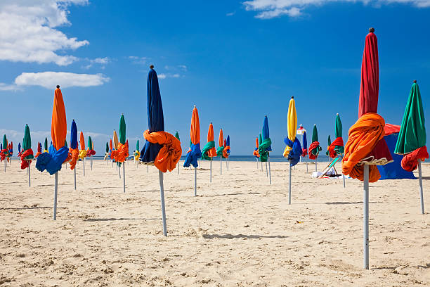 Colorful Parasols on Deauville Beach, Normandy, France, Europe stock photo